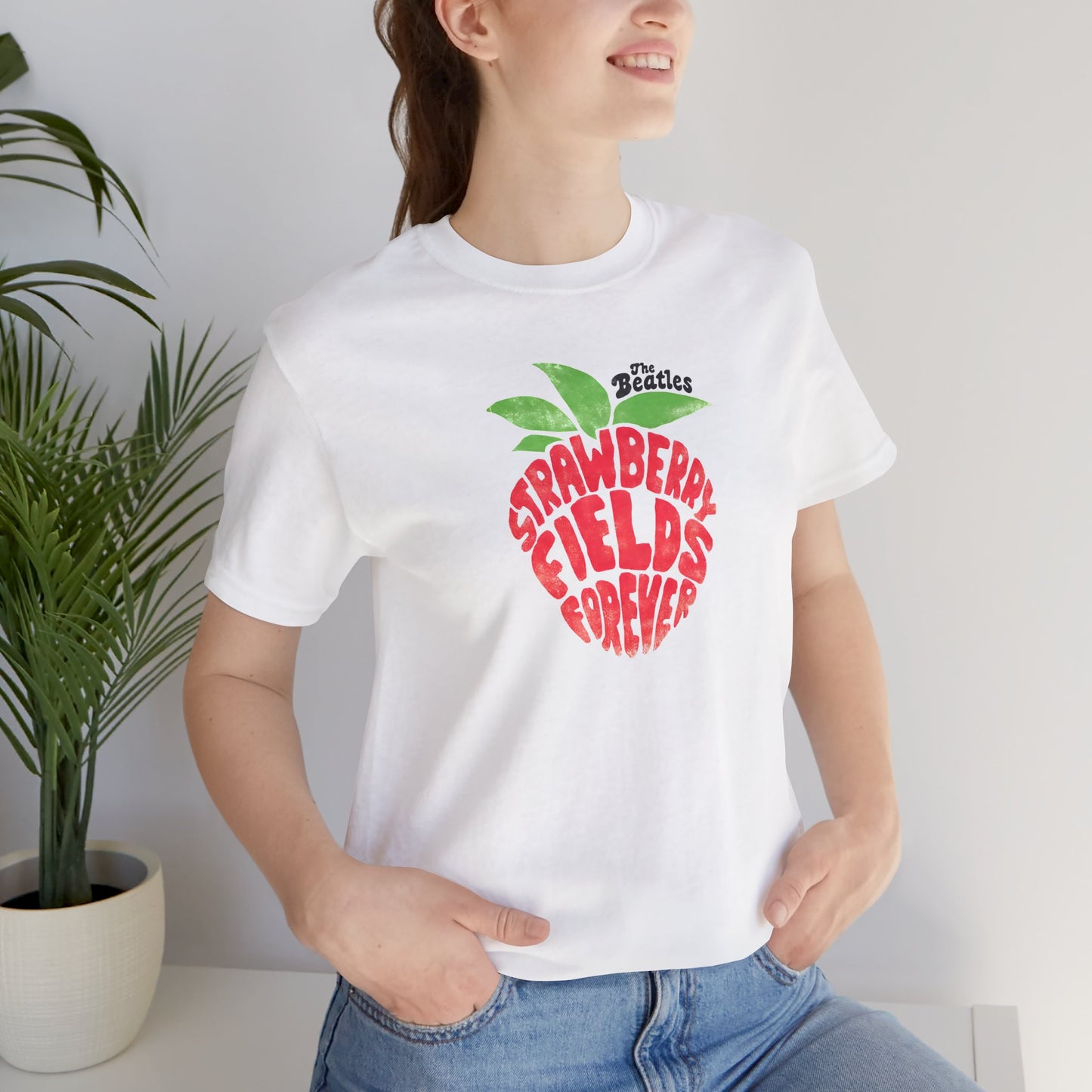 The Beatles White t-shirt with 'Strawberry Fields Forever' design on a white background